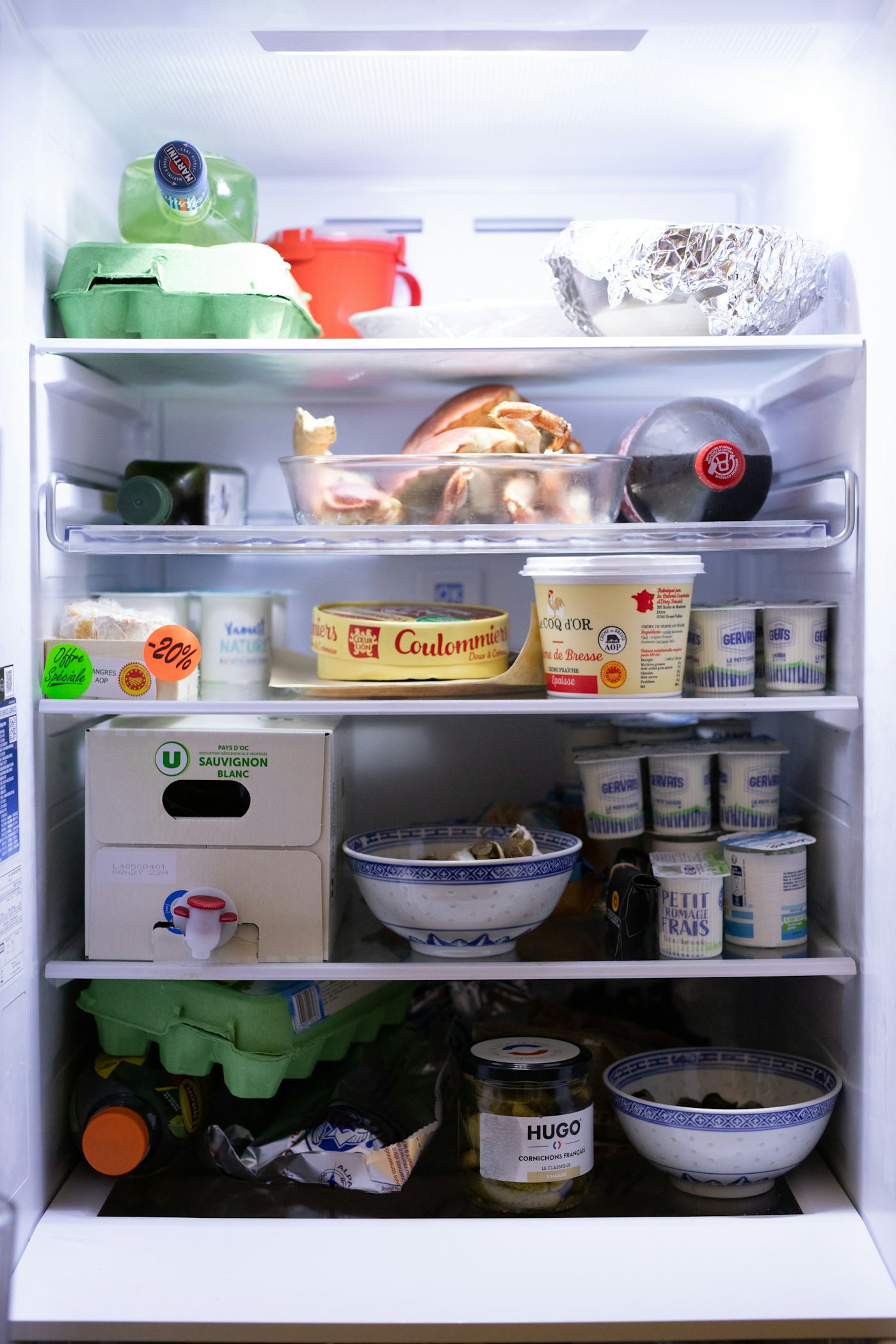 Open refrigerator with food inside
